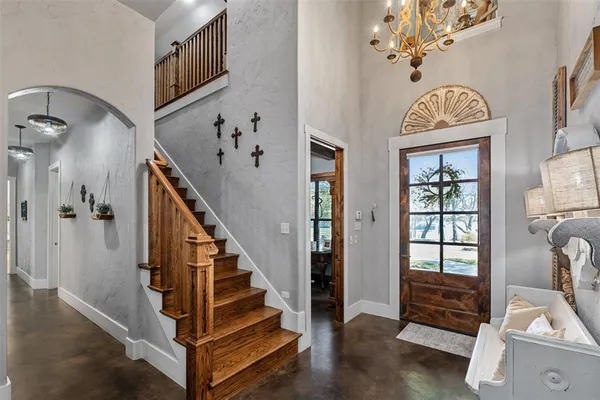 a view of entryway with wooden floor and windows