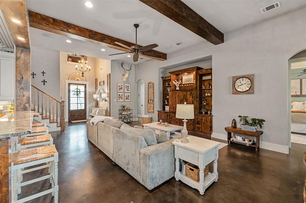 107 Nautical Point Mabank, TX 75143 - Photo 8 of 36 a living room with furniture and a chandelier