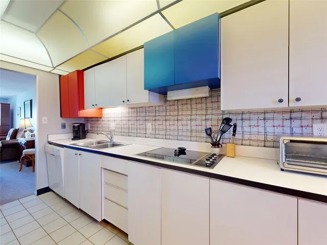 a kitchen with sink cabinets and window