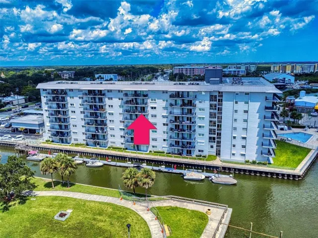a view of a swimming pool with a outdoor seating