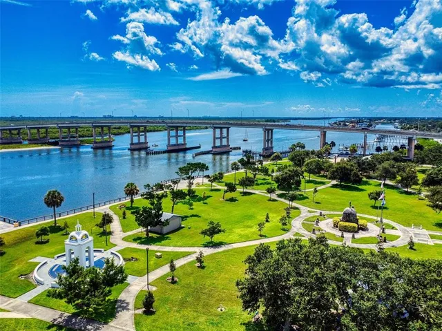 a view of a swimming pool with a yard