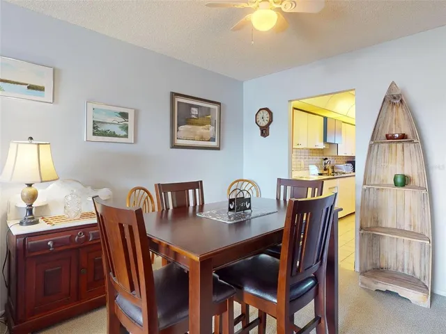 a view of a dining room with furniture and window