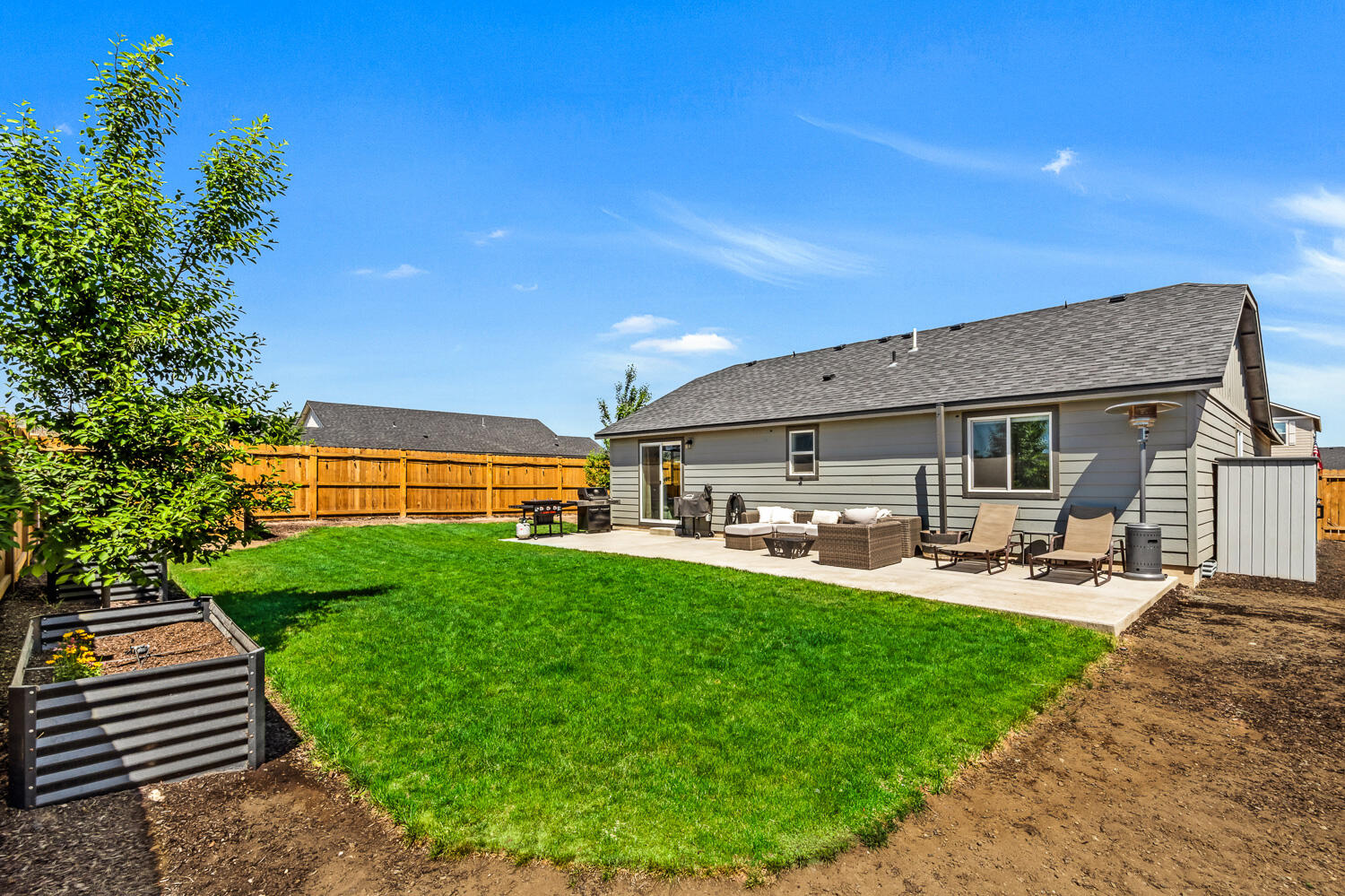 3499 Northwest 9th Lane Redmond, OR 97756 - Photo 25 of 29 Backyard with raised flower beds