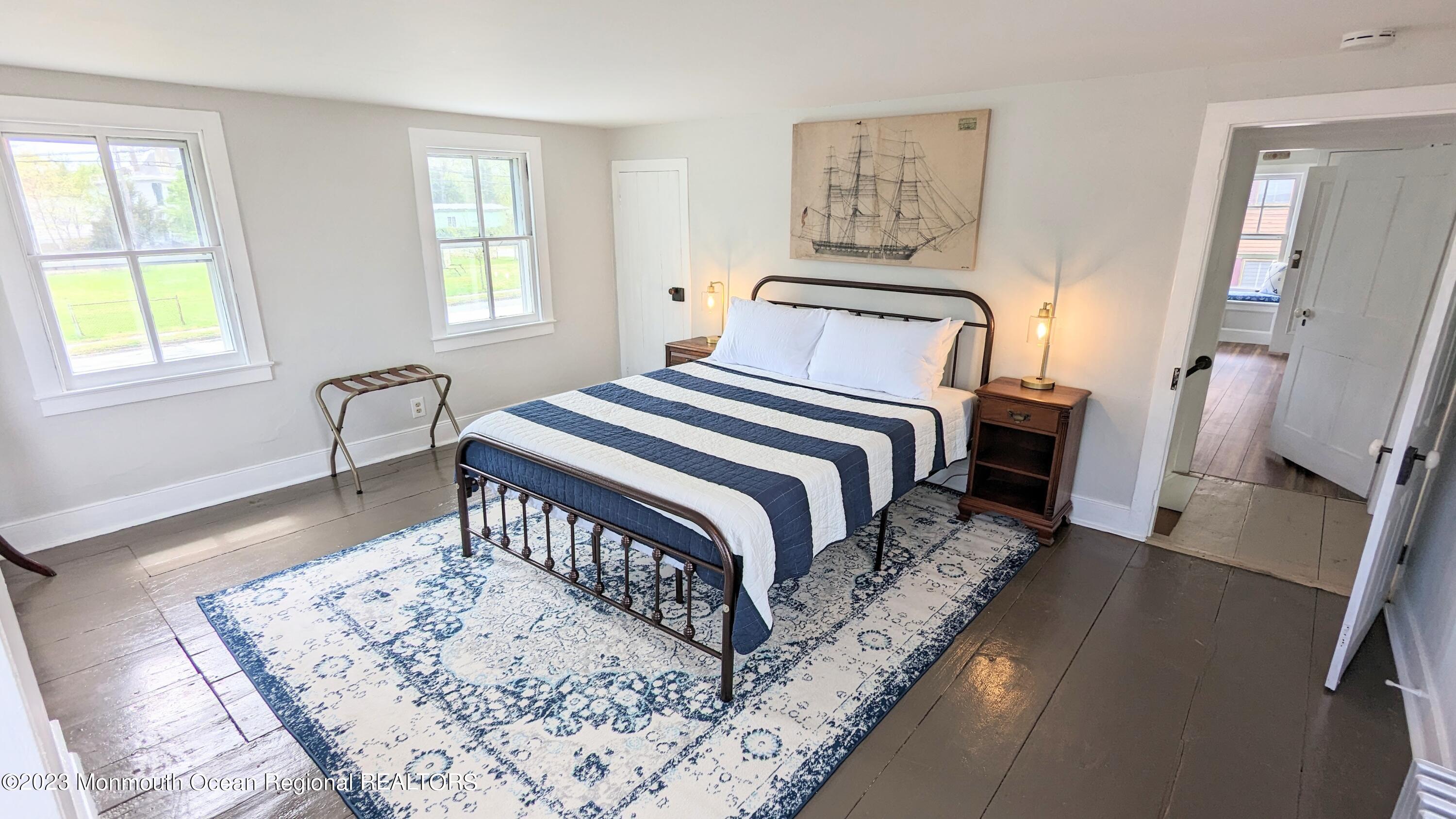 303 Baptist Road Newport, NJ 08345 - Photo 14 of 20 a bedroom with a bed and wooden floor