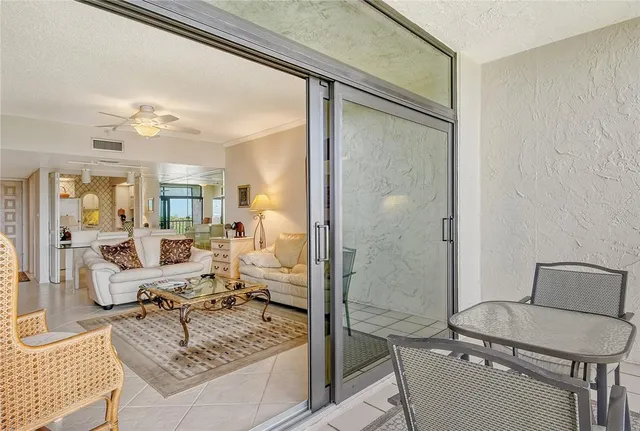 a living room with furniture and a large mirror