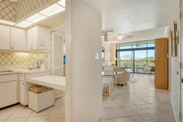 a bathroom with a shower curtain and a sink