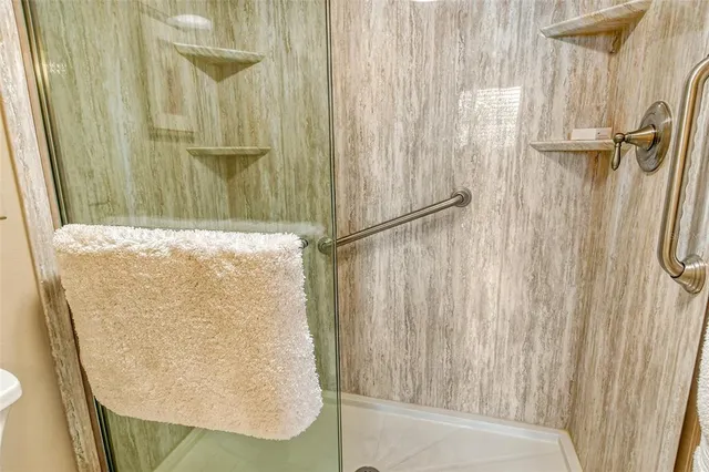 a view of a swimming pool with a lounge chair