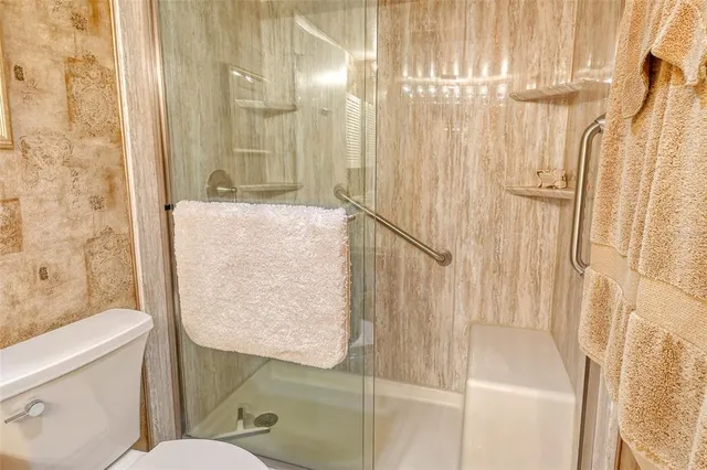 a view of a swimming pool with outdoor seating