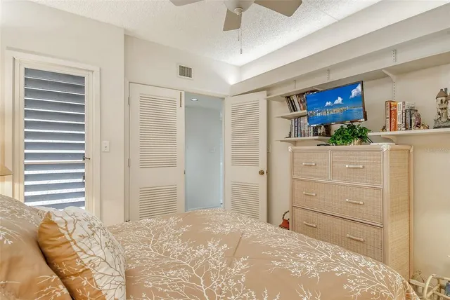 a view of a swimming pool with a patio and a garden