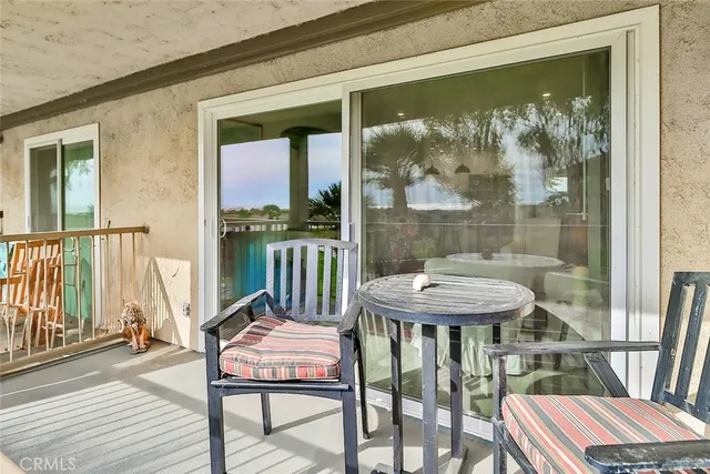 a view of a balcony with chairs