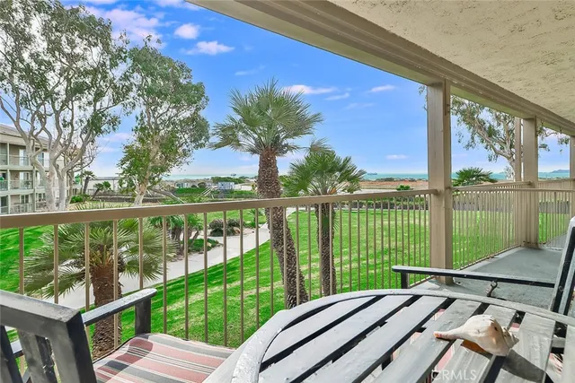 a view of a balcony with lake view and a ocean view