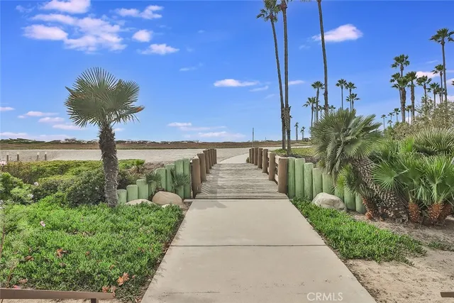a swimming pool with outdoor seating and yard
