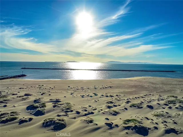 a street sign on a wall next to a road