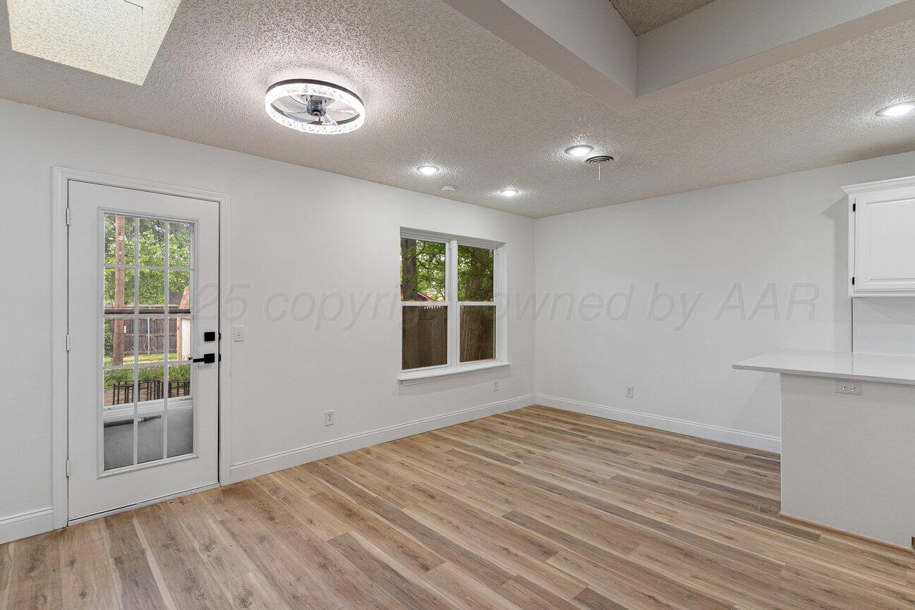 2607 15th Avenue Canyon, TX 79015 - Photo 19 of 54 a view of empty room with wooden floor and fan