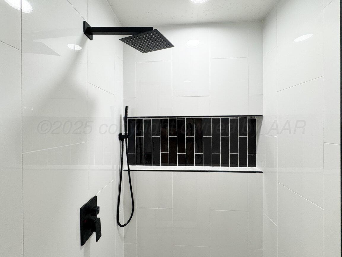 2607 15th Avenue Canyon, TX 79015 - Photo 28 of 54 a bathroom with a shower