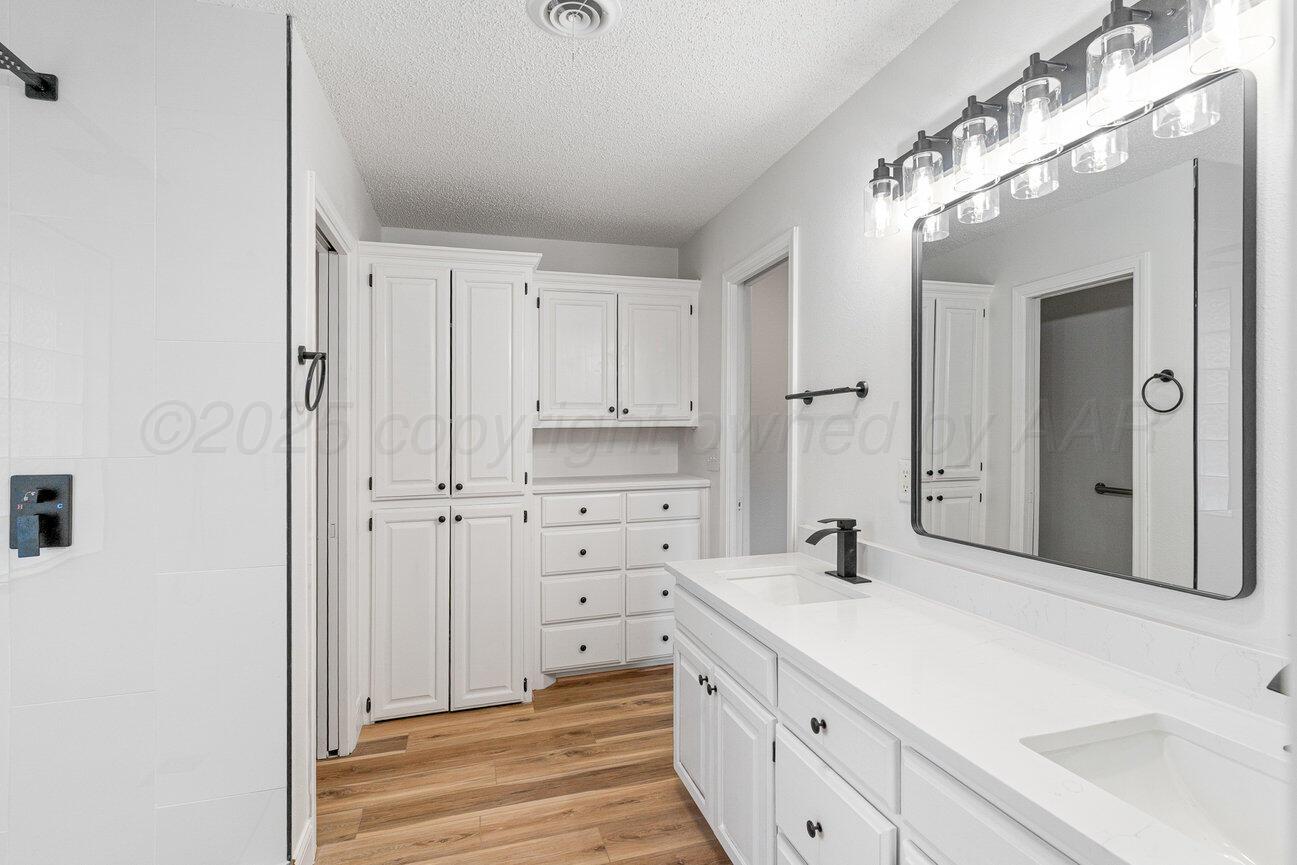 2607 15th Avenue Canyon, TX 79015 - Photo 29 of 54 a spacious bathroom with a double vanity sink mirror and