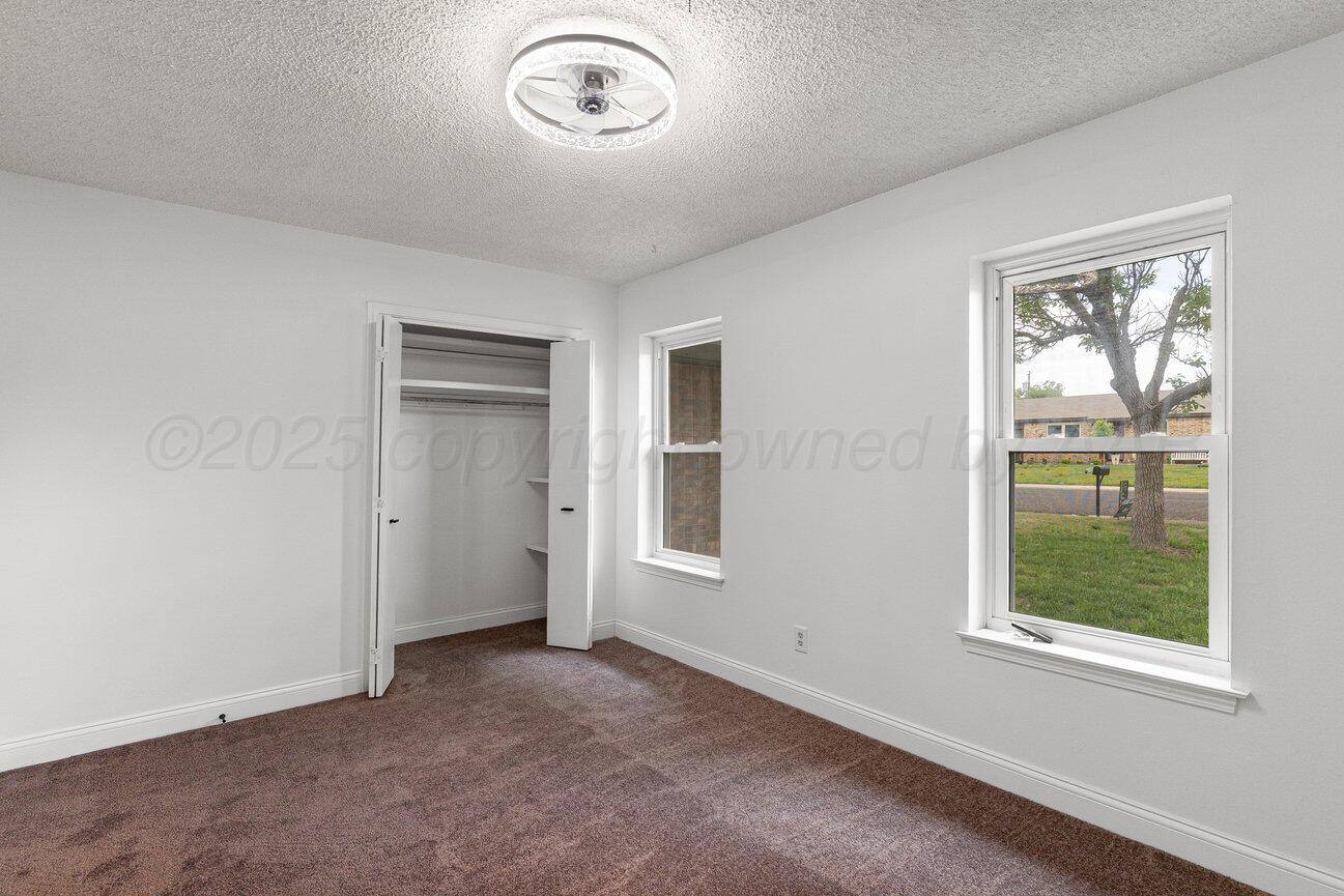 2607 15th Avenue Canyon, TX 79015 - Photo 38 of 54 an empty room with windows