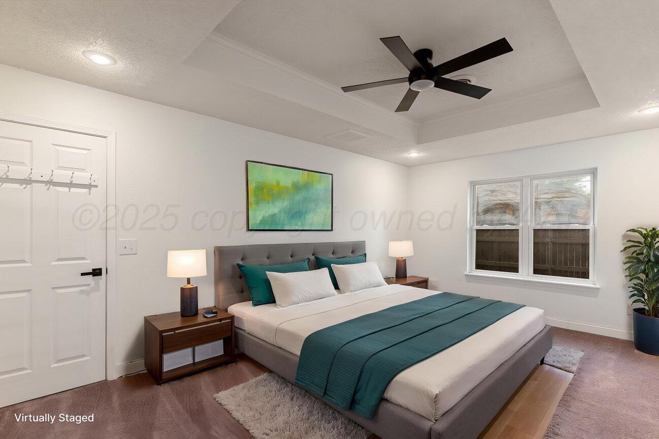2607 15th Avenue Canyon, TX 79015 - Photo 40 of 54 a bedroom with a large bed and a window
