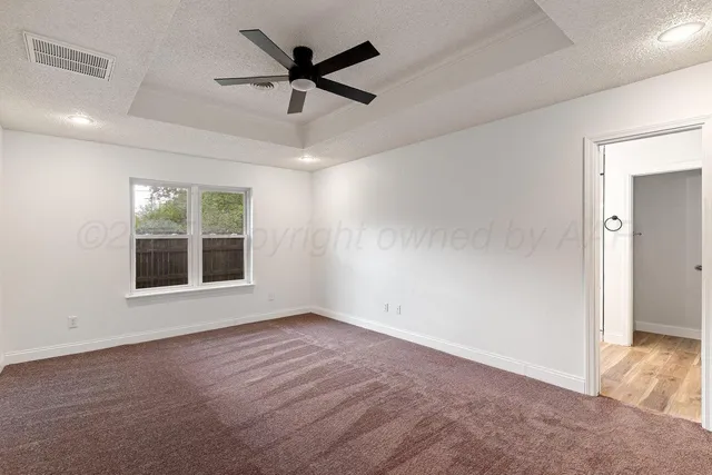 a view of hallway with wooden floor