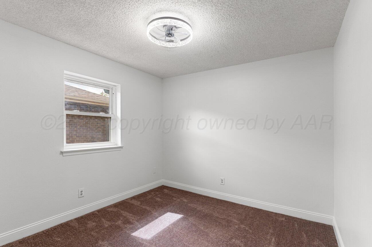 2607 15th Avenue Canyon, TX 79015 - Photo 44 of 54 an empty room with a window