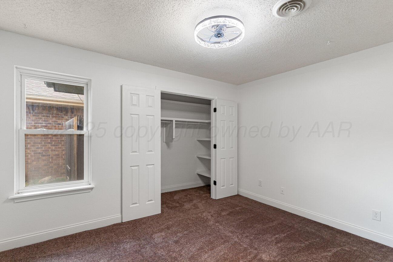 2607 15th Avenue Canyon, TX 79015 - Photo 46 of 54 an empty room with a empty space and windows