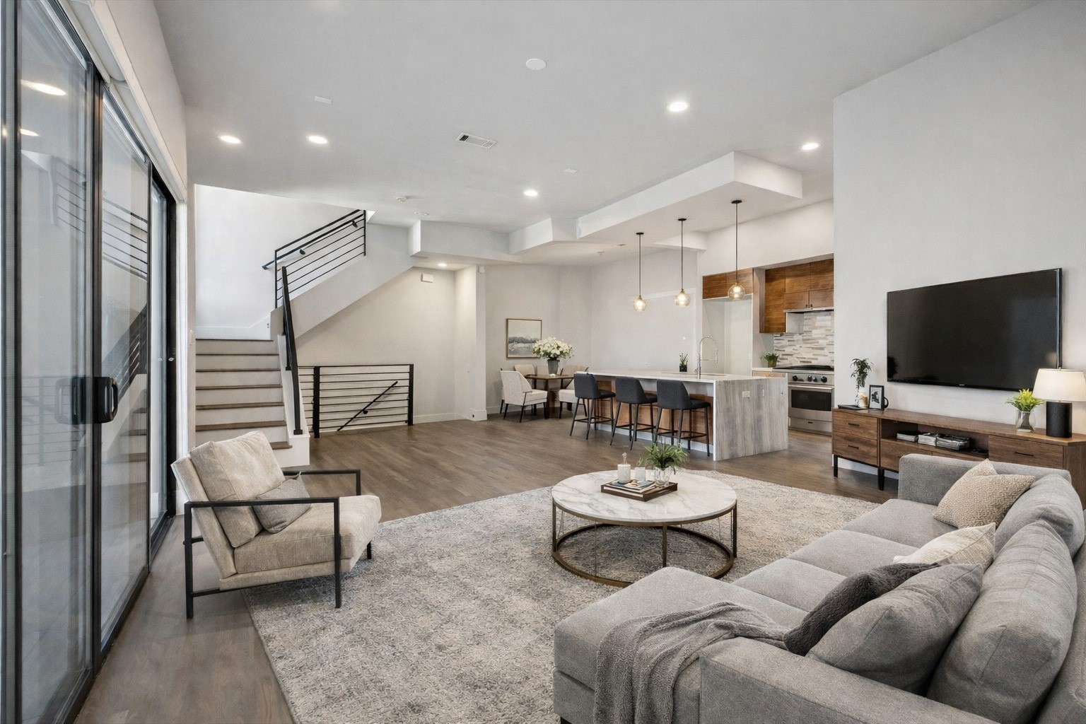 4112 Feagan Street Houston, TX 77007 - Photo 2 of 8 a living room with furniture and a flat screen tv