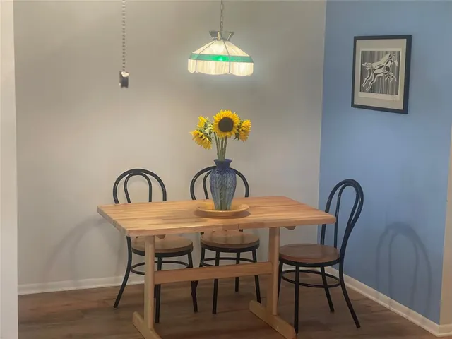 a dining room with furniture and window