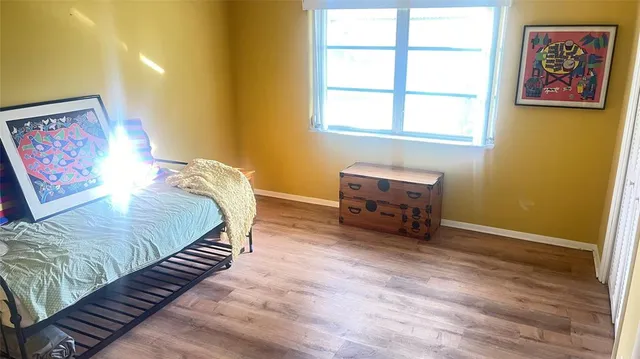 a room with a bed and a window