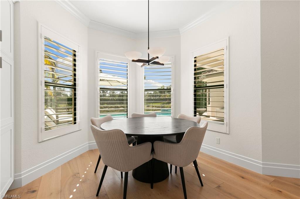 4308 Caldera Circle Naples, FL 34119 - Photo 16 of 44 a dining room with furniture and window