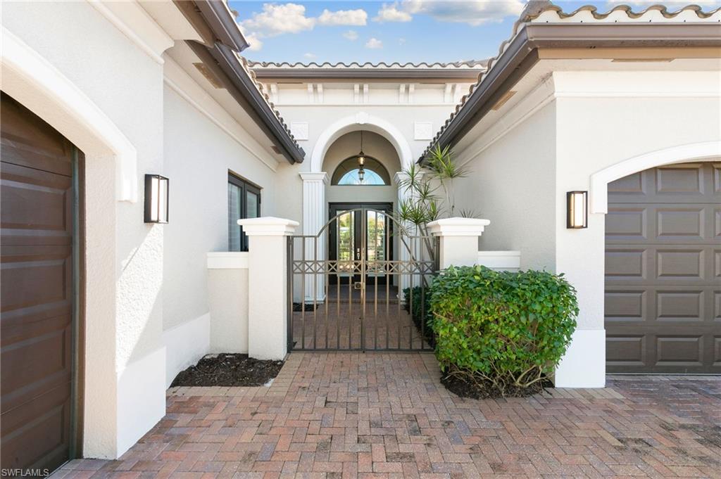 4308 Caldera Circle Naples, FL 34119 - Photo 3 of 44 a view of a entryway door of the house