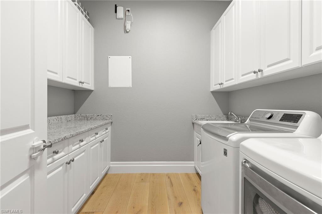 4308 Caldera Circle Naples, FL 34119 - Photo 33 of 44 a view of a kitchen with sink and dishwasher
