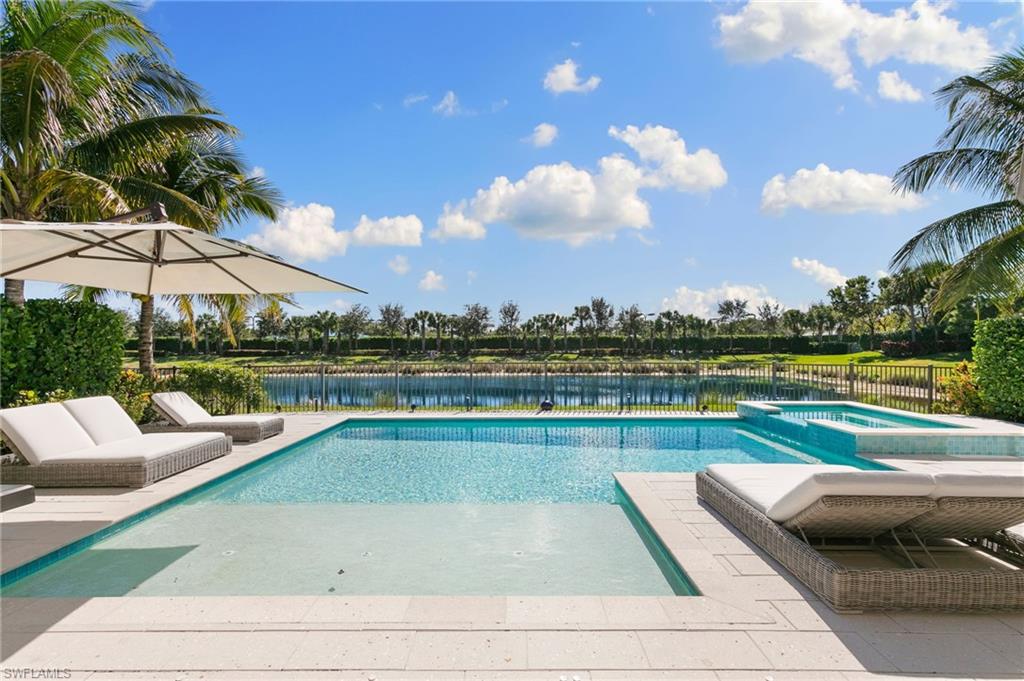 4308 Caldera Circle Naples, FL 34119 - Photo 34 of 44 a view of swimming pool with outdoor seating and plants