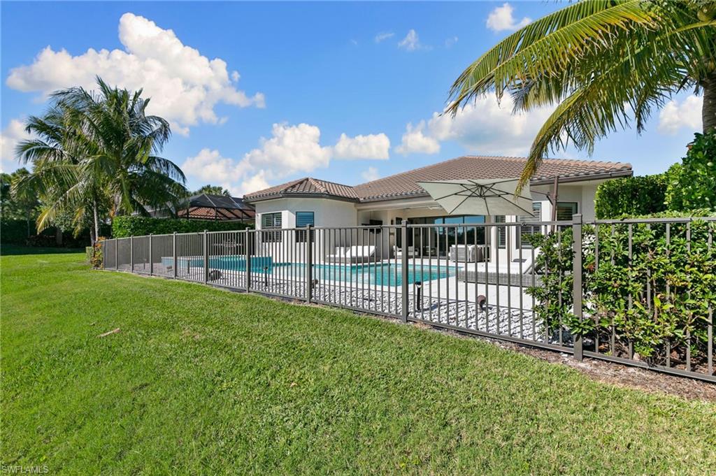 4308 Caldera Circle Naples, FL 34119 - Photo 44 of 44 a view of a house with a garden