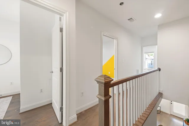 a view of a hallway with washer and dryer