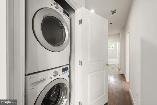 a bedroom with a bed and a lamp