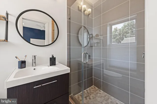 a room with wooden floor and pool table