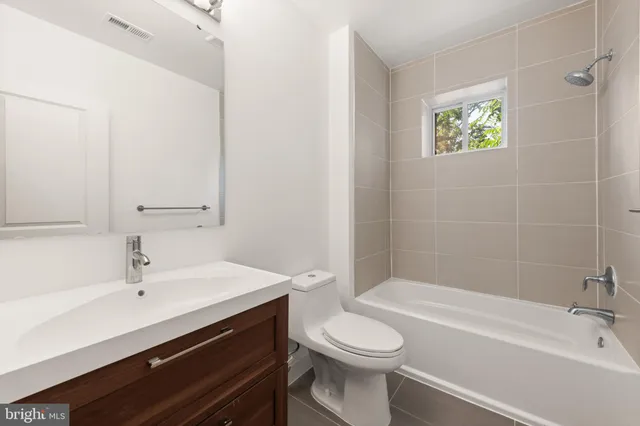 a view of a kitchen with a sink and a window