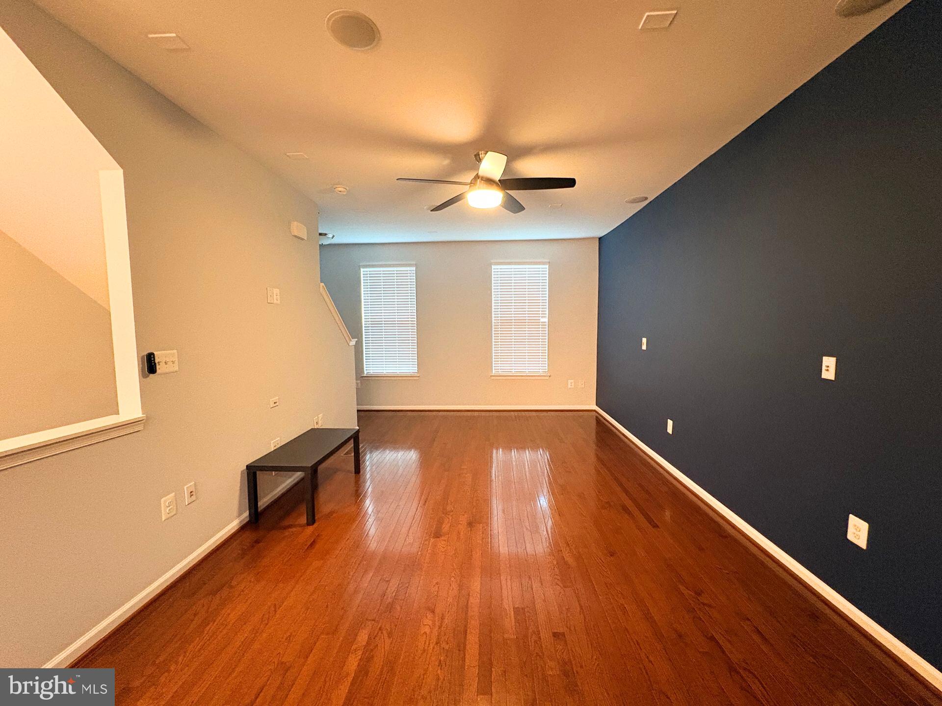 1718 Featherstone Road Woodbridge, VA 22191 - Photo 12 of 23 a view of an empty room with window and wooden floor