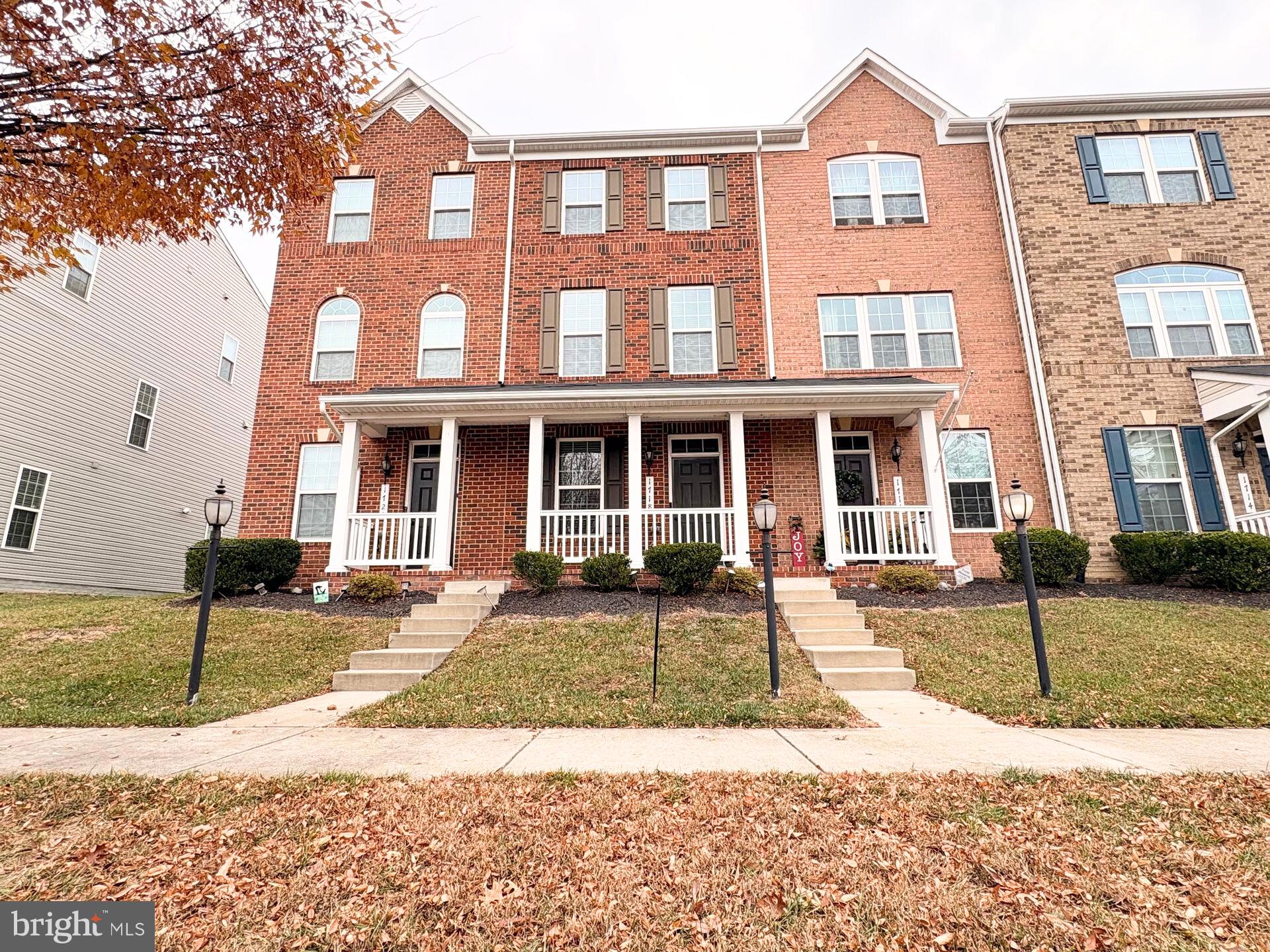 1718 Featherstone Road Woodbridge, VA 22191 - Photo 23 of 23 a front view of a house with a yard