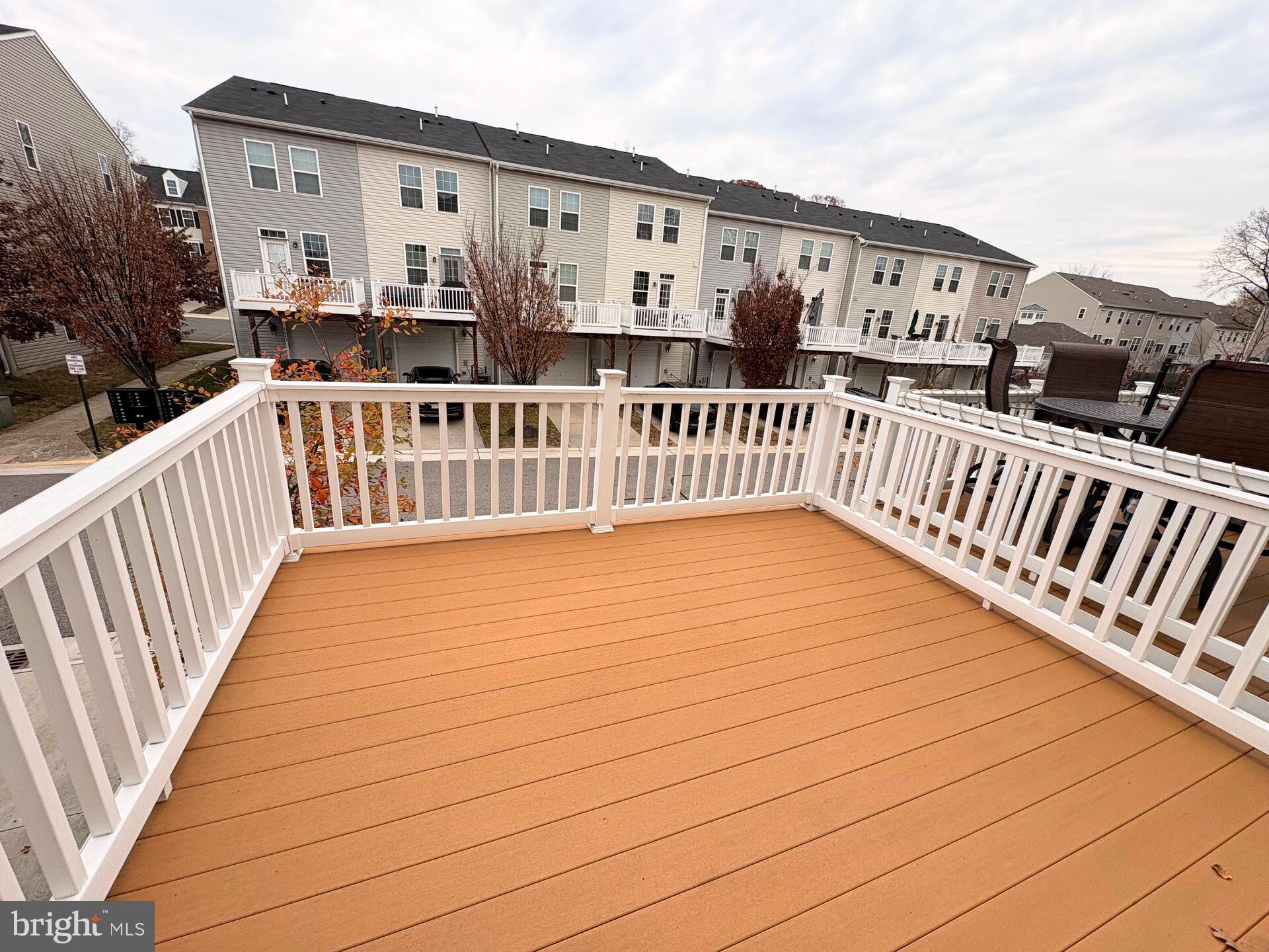 1718 Featherstone Road Woodbridge, VA 22191 - Photo 3 of 23 a view of a house with barbeque and wooden fence
