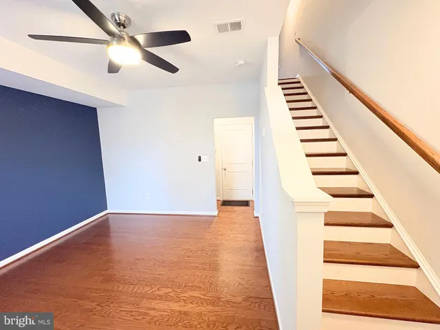 a view of a staircase with white walls