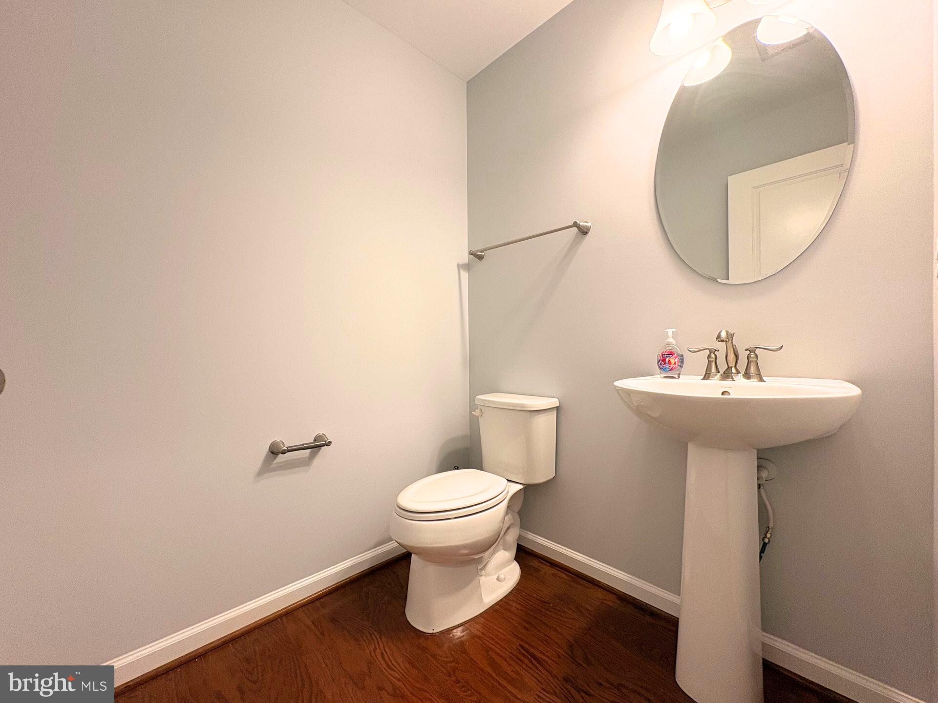 1718 Featherstone Road Woodbridge, VA 22191 - Photo 7 of 23 a bathroom with a sink toilet and a mirror