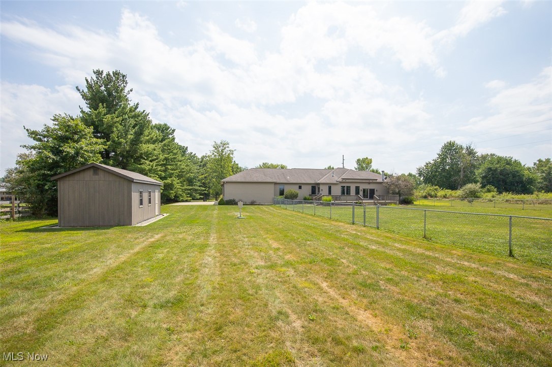 9155 Shank Road Litchfield, OH 44253 - Photo 42 of 47 View of yard with an shed and a view of rural / pastoral area