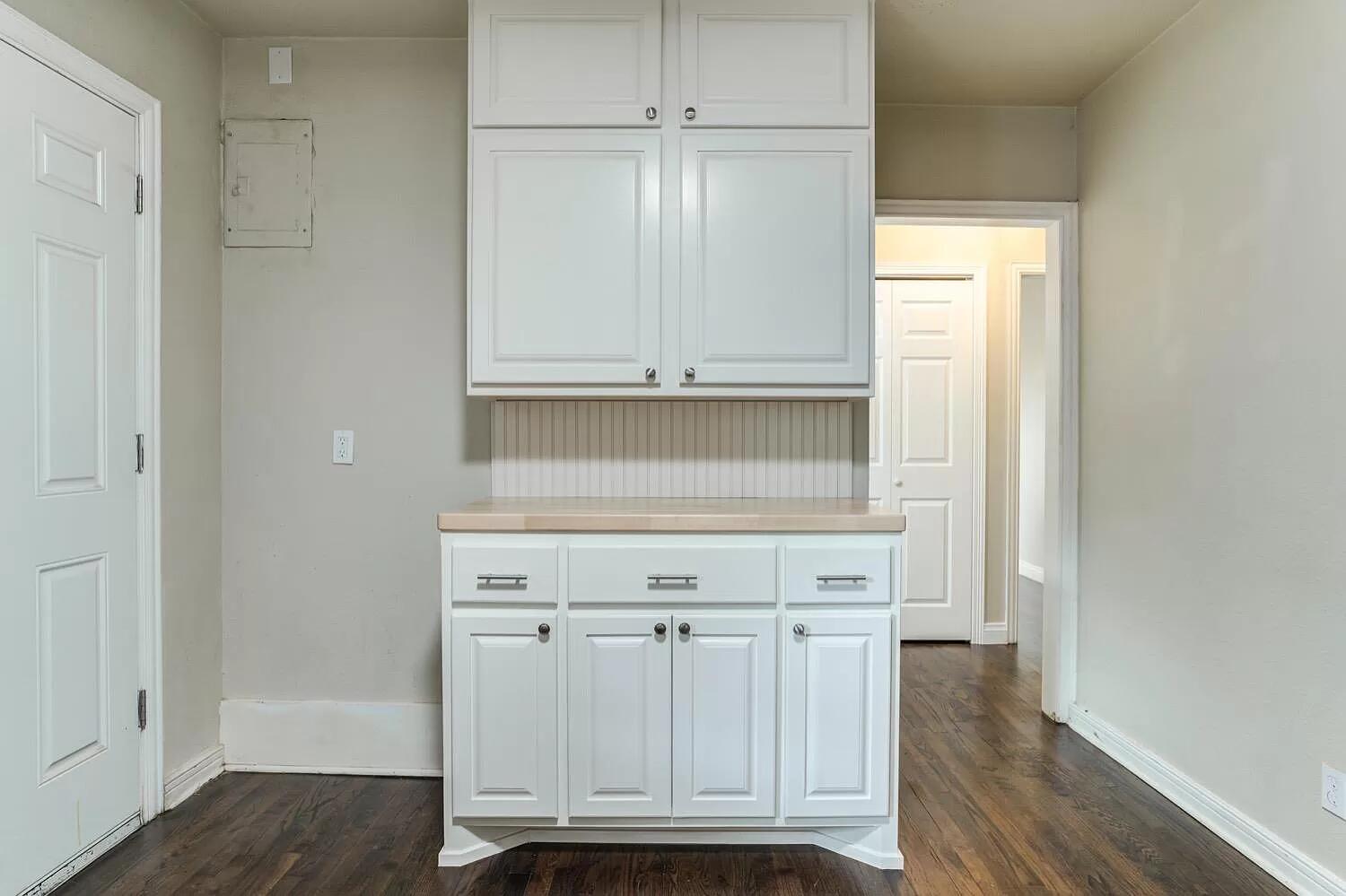 3204 28th Street Lubbock, TX 79410 - Photo 12 of 24 a view of kitchen with white cabinets