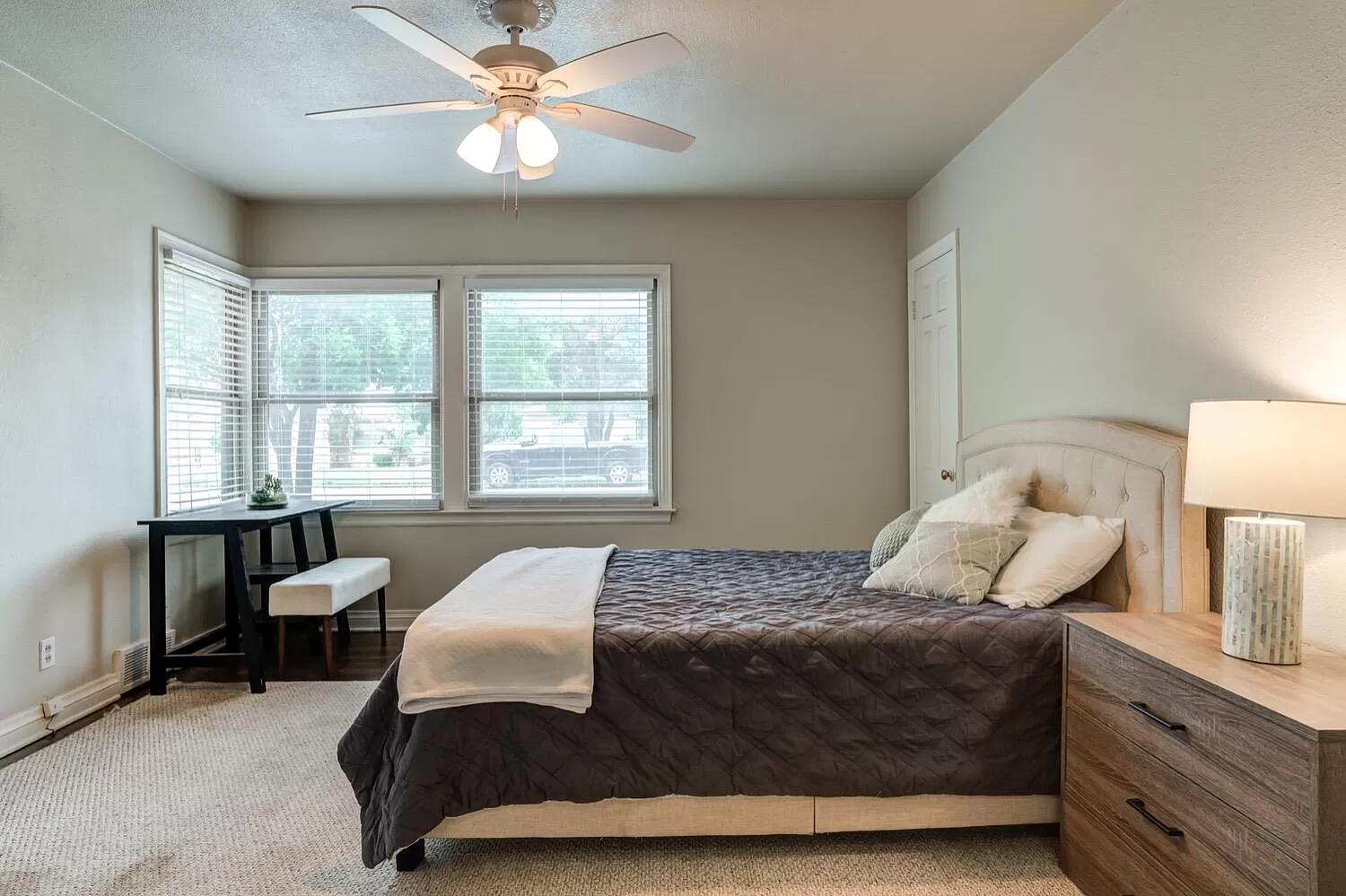 3204 28th Street Lubbock, TX 79410 - Photo 18 of 24 a bedroom with a bed and window