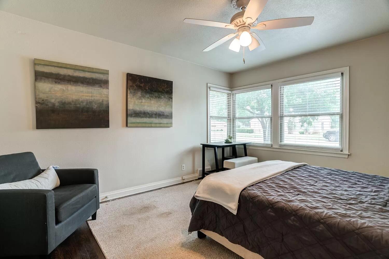 3204 28th Street Lubbock, TX 79410 - Photo 19 of 24 a bedroom with a bed and a window
