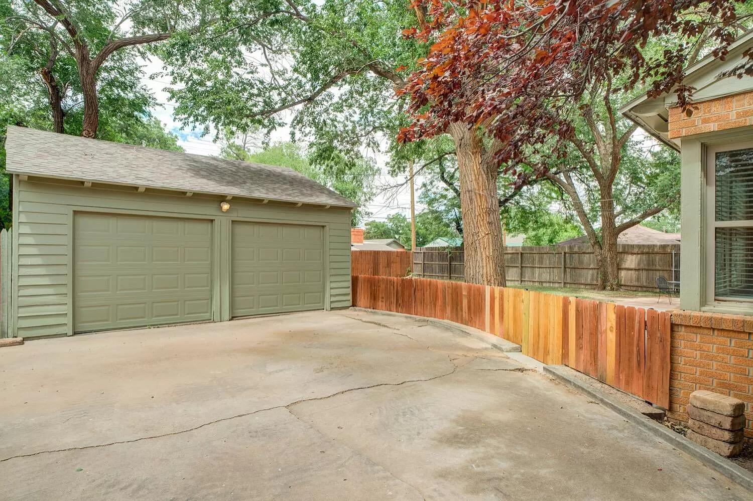 3204 28th Street Lubbock, TX 79410 - Photo 22 of 24 a view of backyard and tree