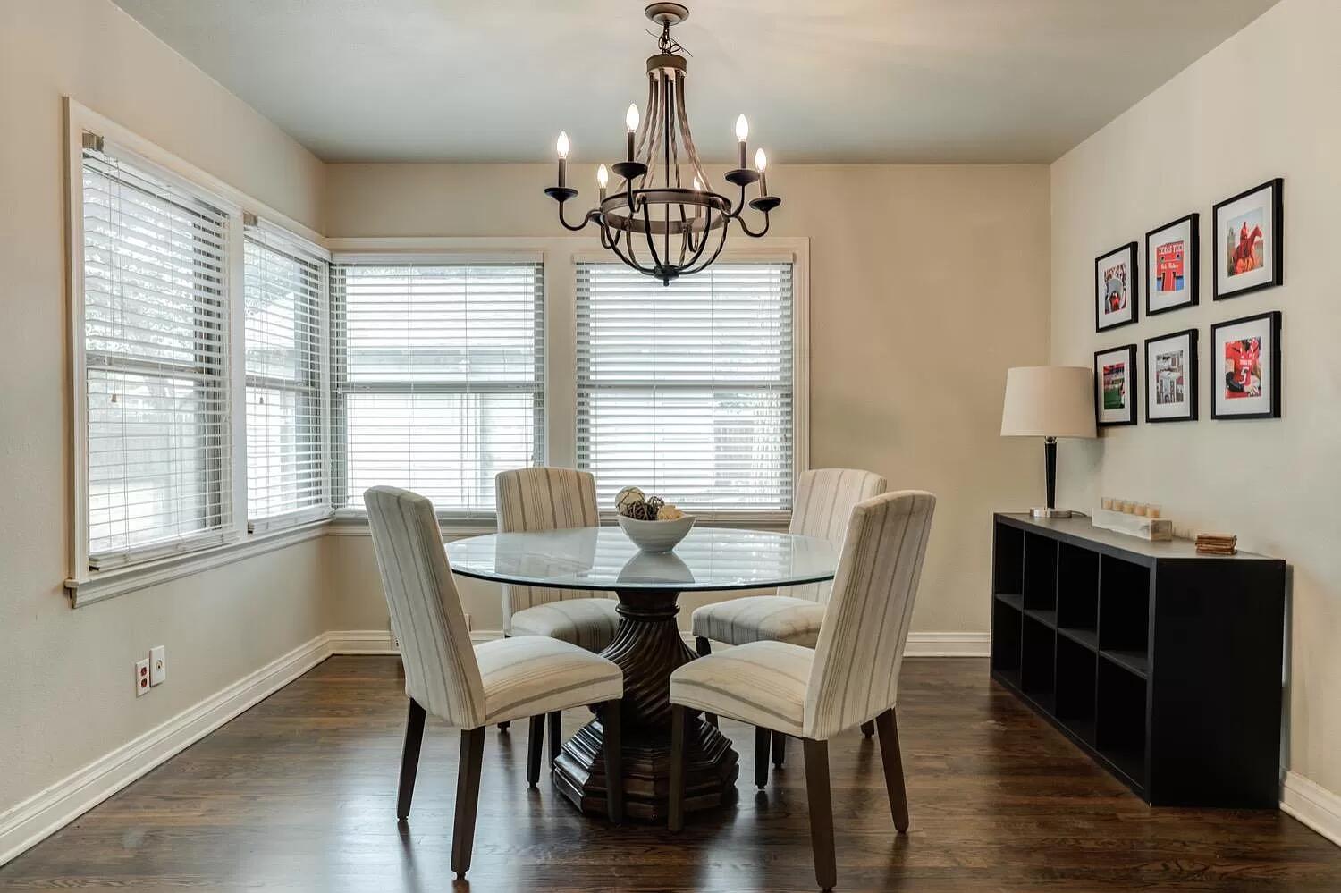 3204 28th Street Lubbock, TX 79410 - Photo 8 of 24 a view of a dining room with furniture window and wooden floor