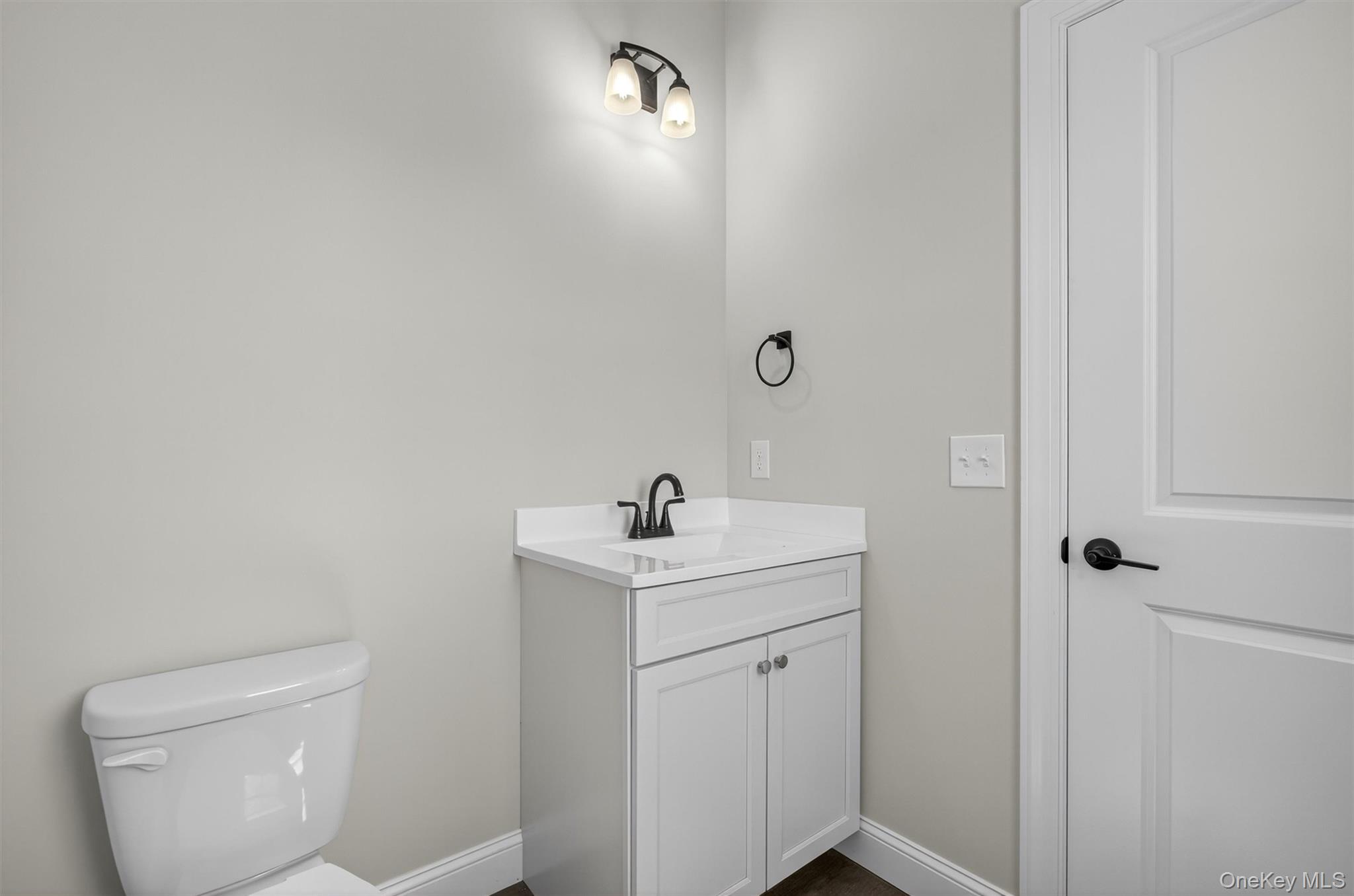 65 Kings Hill Road Walden, NY 12586 - Photo 18 of 41 a bathroom with a toilet sink and vanity