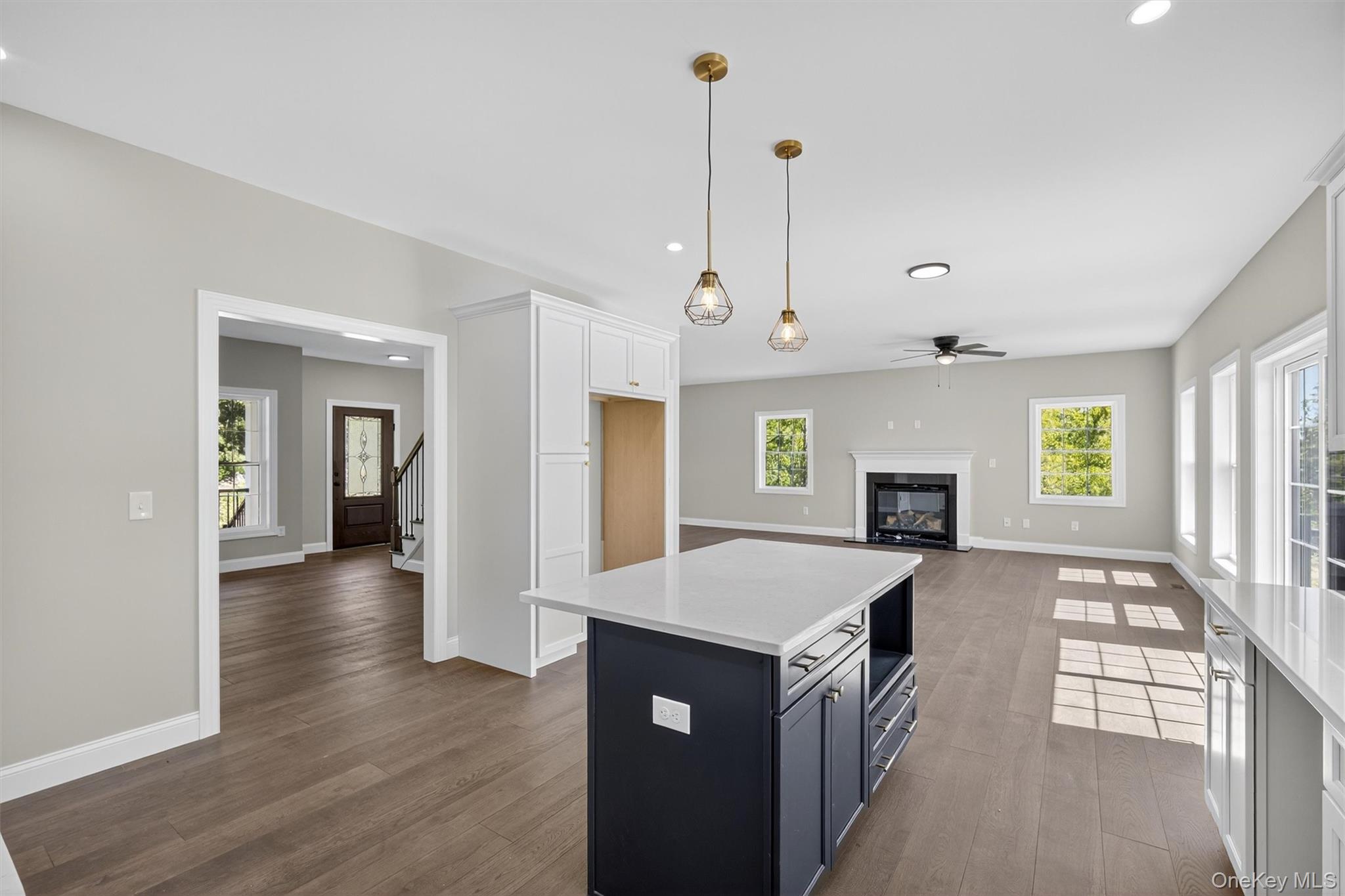 65 Kings Hill Road Walden, NY 12586 - Photo 10 of 41 a large kitchen with kitchen island a island a sink a stove and wooden floors